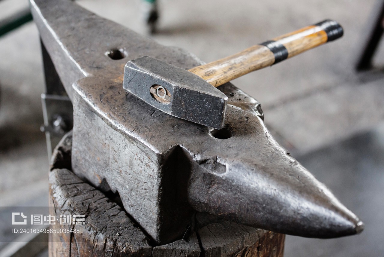 Hammer on iron anvil